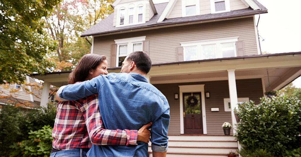 First time home buyers arriving at their new home.