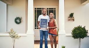 A couple with their first home after getting a first time mortgage 